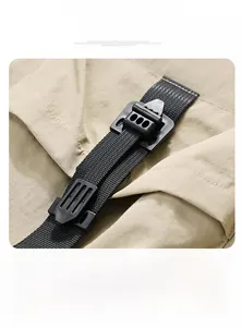 Macro view of adjustable black plastic buckle and nylon strap on khaki outdoor jacket