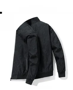Detail of black men's jacket featuring subtle leaf pattern jacquard and ribbed cuffs