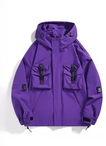 Detail of purple hooded utility jacket featuring multi-pocket design and tactical buckles