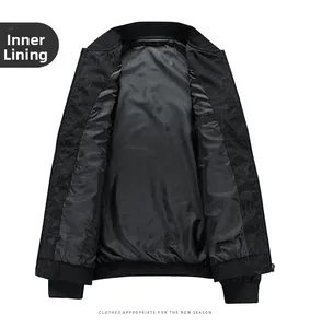 Detail view of black men's jacket featuring leaf-patterned lining and ribbed cuffs