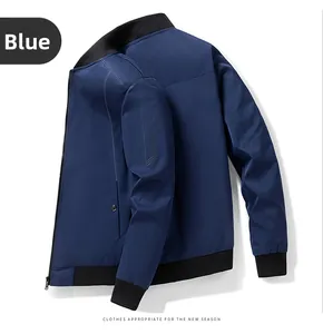 Detail of navy blue bomber jacket showing black ribbed collar and matte synthetic fabric
