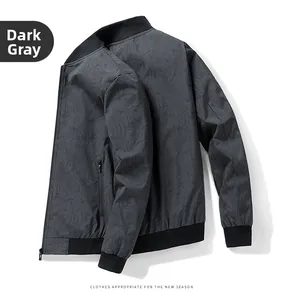 Detail of dark grey jacket featuring palm leaf texture and black ribbed collar