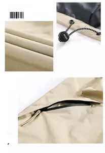 Detail of khaki jacket showing drawstring toggle with DREAM text and hidden side pocket zipper