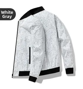 Detail of grey tropical leaf pattern on lightweight bomber jacket with black ribbed trims