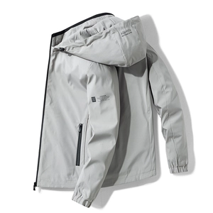 Men's light grey hooded windbreaker jacket with technical waterproof fabric and zipper pockets