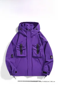 Detail view of purple hooded mountain jacket with four large functional pockets