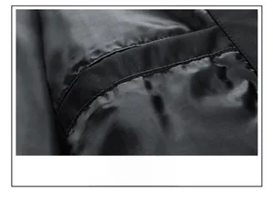 Detailed macro view of a hidden inner pocket on a black men's casual jacket
