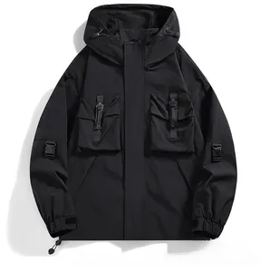Detail of black hooded techwear jacket featuring multi-pocket design and windproof zippers