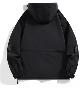 Back view of black outdoor hooded jacket featuring weather-resistant fabric and clean seam details