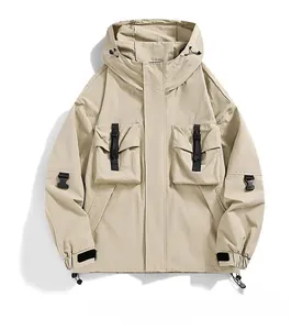 Macro detail of khaki outdoor jacket showing multi-pocket design and tactical buckles