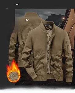 Detail view of khaki cotton bomber jacket featuring warm quilted lining and utility arm pocket