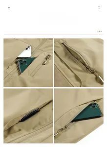 Detail of khaki fishing vest showing multi-pocket storage capacity and zipper closures