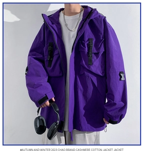 Detail of purple oversized hooded cargo jacket with utility pockets and techwear straps