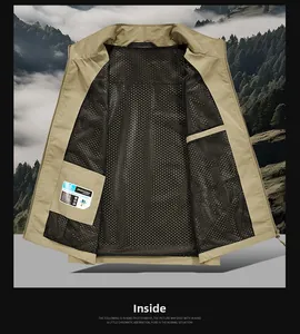 Detail of breathable black mesh lining and hidden inner pocket on khaki fishing vest