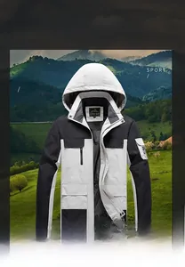 Detail of windproof outdoor jacket featuring adjustable hood and zip pockets in tricolor