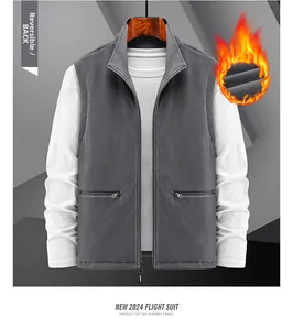 Detail view of reversible grey fleece vest with zipper pockets and thermal lining