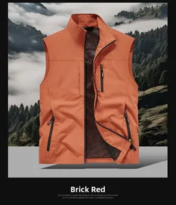 Detail view of brick red fishing vest showing zipper pockets and breathable mesh lining