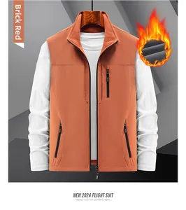 Detail of brick red fleece lining and functional pockets on men's utility vest