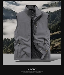 Detail of grey multi-pocket tactical vest featuring mesh lining and standing collar