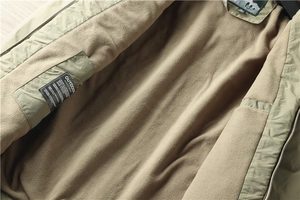 Détail de la doublure en polaire chaude et de la poche intérieure de la veste outdoor
