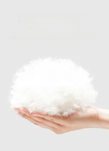 Detail showing premium white down insulation with high loft and soft fiber texture
