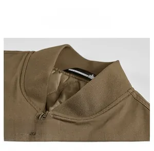 Detailed macro view of the ribbed knit collar and quilted lining of the bomber jacket