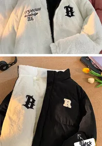 Detail of reversible jacket showing white fleece side and black corduroy interior texture