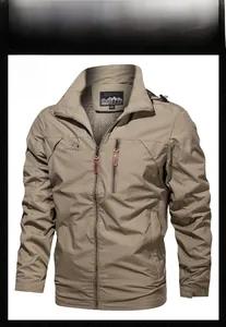 Detail of khaki outdoor jacket with hood, chest logo, and side pockets with leather zippers
