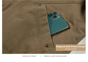 Macro detail of slanted side pocket with metal rivets on brown cotton bomber jacket