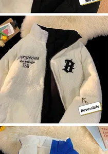 Detail of reversible winter jacket showing white fleece side and black corduroy texture