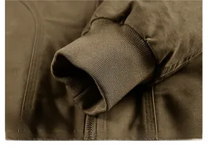 Close-up of ribbed elastic cuffs on a thick brown cotton twill flight jacket