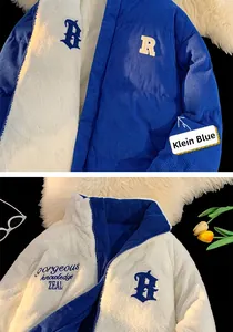 Detail of reversible blue corduroy jacket with white fleece lining and street style embroidery