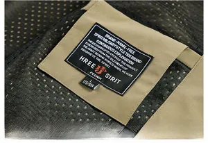 Detailed view of the military style neck label and breathable mesh fabric on the vest