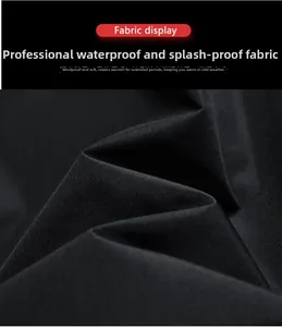 Close-up of black technical fabric with waterproof windproof and thermal properties