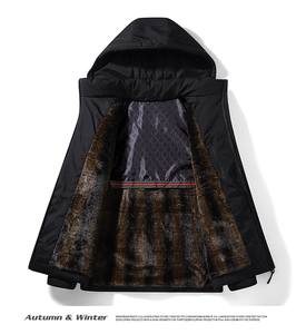 Detail view of winter vest featuring brown faux fur lining and red-green stripe accent