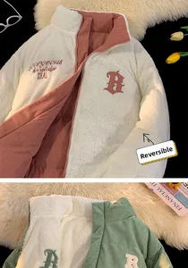 Detail of reversible winter jacket showing white sherpa fleece and corduroy sides