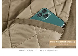 Detail view of inner quilted pocket showing stitching quality and smartphone capacity
