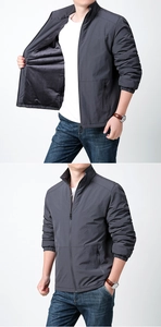 Detail of warm fleece lining and stand collar on men's dark grey outdoor jacket