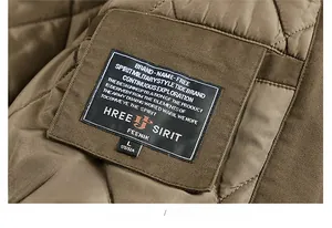 Detail view of the men's bomber jacket showing diamond quilted lining and brand neck label