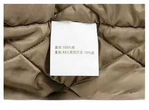 Detail view of the quilted jacket lining with 100% cotton fabric care label information