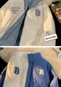 Detail of reversible jacket with white faux fur, blue corduroy and embroidery accents