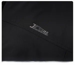 Detail of the JL SPORT CLIMB silver print and durable double stitching on black winter jacket