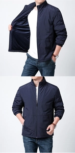 Detail view of men's navy outdoor jacket showing windproof fabric and inner lining