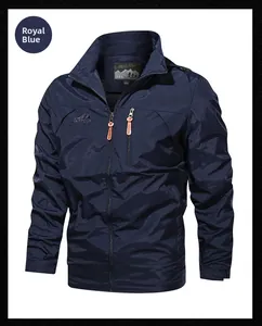 Close-up of royal blue outdoor jacket with OUTDOOR embroidery and orange zippers
