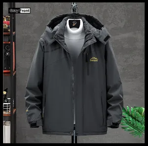 Detail of dark grey outdoor jacket featuring a waterproof zipper and mountain logo embroidery
