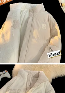 Detail view of khaki corduroy and white fleece reversible winter puffer jacket