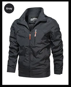 Detail of gray outdoor windproof jacket featuring chest zipper and outdoor logo