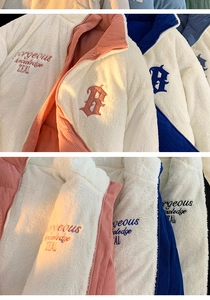 Detailed view of winter jacket featuring white sherpa fleece and corduroy patchwork