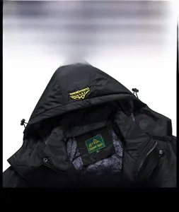 Close-up of winter jacket collar showing thick grey fleece lining and embroidered hood logo
