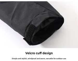 Détail du poignet réglable par velcro sur une veste chauffante imperméable de plein air